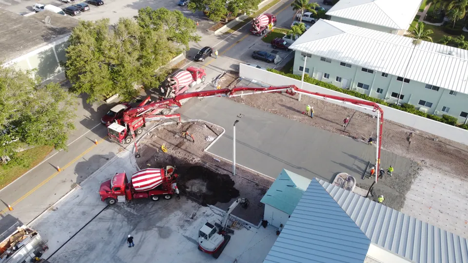 Boom pump and mixer on a commercial slab pour, aerial view