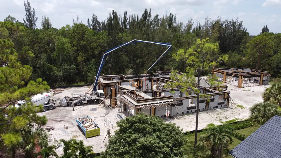Boom pump over a waterfront foundation